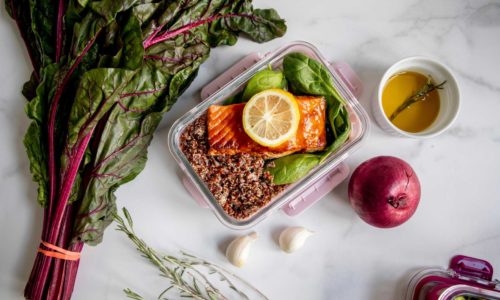 healthy salmon meal cooking in an air fryer