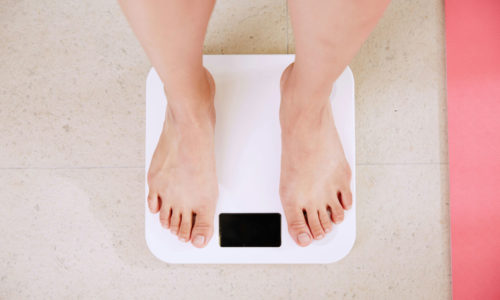 feet standing on a scale
