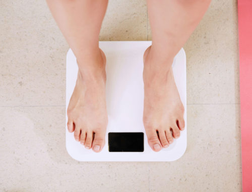 feet standing on a scale