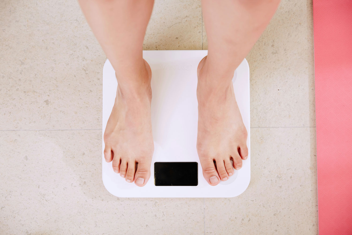 feet standing on a scale